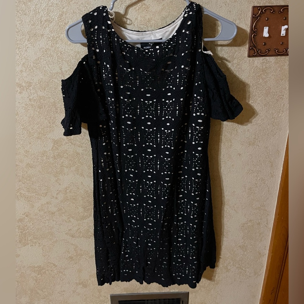 Cold shoulder black and tan dress.